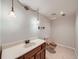 Bathroom with a single vanity, decorative lighting, and a tiled floor at 1467 S Kenton St, Aurora, CO 80012