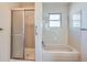 Bright bathroom featuring a shower and tub combination at 1467 S Kenton St, Aurora, CO 80012