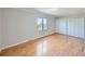 Bedroom with wood flooring, large window, and double closet at 1467 S Kenton St, Aurora, CO 80012