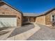 Inviting brick home with a two-car garage and well-maintained landscaping leading to the front door at 1467 S Kenton St, Aurora, CO 80012