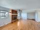 Inviting living room showcasing hardwood floors, a fireplace, and ample natural light at 1467 S Kenton St, Aurora, CO 80012