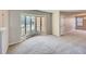 Bright living room featuring a large bay window and neutral carpet at 1467 S Kenton St, Aurora, CO 80012