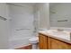 Clean bathroom with a tub, shower, and vanity at 1267 Bluejay Ave, Brighton, CO 80601