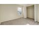 Cozy bedroom with neutral walls, carpet flooring, and a closet at 1267 Bluejay Ave, Brighton, CO 80601