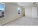 Spacious bedroom with neutral walls, carpet flooring, and two windows at 1267 Bluejay Ave, Brighton, CO 80601