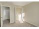 Spacious bedroom with neutral walls and carpet flooring at 1267 Bluejay Ave, Brighton, CO 80601