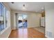 Dining area with hardwood floors and sliding glass door to the backyard at 1267 Bluejay Ave, Brighton, CO 80601