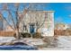 Two-story house with light beige siding, blue door, and attached garage at 1267 Bluejay Ave, Brighton, CO 80601