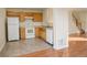 Small kitchen with light oak cabinets and white appliances at 1267 Bluejay Ave, Brighton, CO 80601