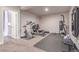 Basement home gym equipped with various machines and weights, creating the perfect fitness space at 15647 Weaver Gulch Dr, Morrison, CO 80465