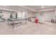 Basement rec room offers space for entertainment, including a ping pong table and cozy seating area at 15647 Weaver Gulch Dr, Morrison, CO 80465