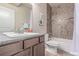 Updated bathroom featuring stylish tile, modern fixtures, and vanity with granite countertop at 15647 Weaver Gulch Dr, Morrison, CO 80465