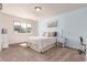 Comfortable bedroom with a cozy bed, stylish decor, and a picturesque window showcasing stunning views at 15647 Weaver Gulch Dr, Morrison, CO 80465