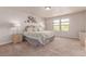 Bright bedroom with neutral paint, carpet flooring, and natural light from the window at 15647 Weaver Gulch Dr, Morrison, CO 80465