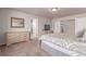 This bedroom features neutral paint, carpet flooring, and direct access to the bathroom at 15647 Weaver Gulch Dr, Morrison, CO 80465