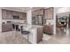 This open kitchen features stainless steel appliances, a center island and dark wood cabinets at 15647 Weaver Gulch Dr, Morrison, CO 80465