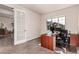 Office space featuring a large desk, natural light and hardwood flooring at 15647 Weaver Gulch Dr, Morrison, CO 80465