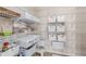 This walk-in pantry has ample storage space, with shelving and white storage bins at 15647 Weaver Gulch Dr, Morrison, CO 80465