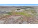 Aerial view of a house and expansive property with outbuildings at 45425 Wolf Creek Dr, Bennett, CO 80102