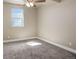 Spacious basement bedroom with carpeted floors and a window at 45425 Wolf Creek Dr, Bennett, CO 80102