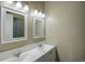 Bathroom with double vanity, large mirrors, and updated fixtures at 45425 Wolf Creek Dr, Bennett, CO 80102