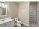 Clean bathroom with single vanity, toilet and shower at 45425 Wolf Creek Dr, Bennett, CO 80102