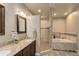 Spa-like bathroom with double vanity, soaking tub, and walk-in shower at 45425 Wolf Creek Dr, Bennett, CO 80102