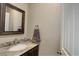 Powder room with granite vanity and modern fixtures at 45425 Wolf Creek Dr, Bennett, CO 80102