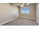 Spacious bedroom with neutral carpeting and large window at 45425 Wolf Creek Dr, Bennett, CO 80102