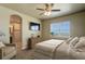 Comfortable bedroom with ensuite bathroom and large window at 45425 Wolf Creek Dr, Bennett, CO 80102