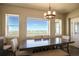 Bright dining area with large window offering scenic views at 45425 Wolf Creek Dr, Bennett, CO 80102