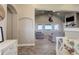 View of living room from entryway, showcasing high ceilings and a fireplace at 45425 Wolf Creek Dr, Bennett, CO 80102