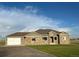 Ranch style home with stone accents and a two-car garage at 45425 Wolf Creek Dr, Bennett, CO 80102