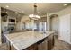 Island kitchen with granite countertops and stainless steel appliances at 45425 Wolf Creek Dr, Bennett, CO 80102