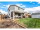 Backyard with covered patio, grill, and shed at 6119 Zenobia Ct, Arvada, CO 80003