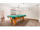 Basement recreation room with pool table and carpet flooring at 6119 Zenobia Ct, Arvada, CO 80003