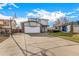 Two-story house with attached garage and basketball hoop at 6119 Zenobia Ct, Arvada, CO 80003