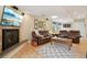 Finished basement with a fireplace, large screen tv, and leather furniture at 9158 Forest St, Firestone, CO 80504