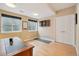 Finished basement area with two windows and dartboard feature at 9158 Forest St, Firestone, CO 80504