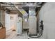 This is a view of the mechanical components in the basement with a doorway to another room at 9158 Forest St, Firestone, CO 80504