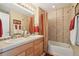 Bathroom with a double vanity, tile floors, and shower/bathtub combination at 9158 Forest St, Firestone, CO 80504