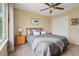Bedroom with neutral paint, ceiling fan and carpeted floors at 9158 Forest St, Firestone, CO 80504
