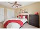 Bedroom with neutral paint, ceiling fan and carpeted floors at 9158 Forest St, Firestone, CO 80504