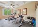 This functional home gym features state of the art fitness equipment and a ceiling fan at 9158 Forest St, Firestone, CO 80504