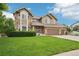 Charming two-story home with manicured lawn, three-car garage, and inviting stone accents at 9158 Forest St, Firestone, CO 80504