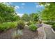 Charming backyard landscaping features mulch, gravel path, greenery, and decorative rocks at 9158 Forest St, Firestone, CO 80504