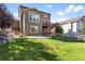 Expansive backyard with a patio, deck, lush lawn, and attractive landscaping, perfect for outdoor enjoyment at 3008 Echo Park Dr, Castle Rock, CO 80104