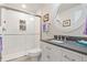 Bathroom with a modern shower, white subway tile, and a vanity with a round mirror at 3008 Echo Park Dr, Castle Rock, CO 80104