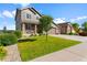 Well-manicured lawn in front of home featuring a large three-car garage and covered front porch at 3008 Echo Park Dr, Castle Rock, CO 80104