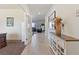 Inviting foyer with neutral tile floors, an accent cabinet, and views into the living area at 3008 Echo Park Dr, Castle Rock, CO 80104